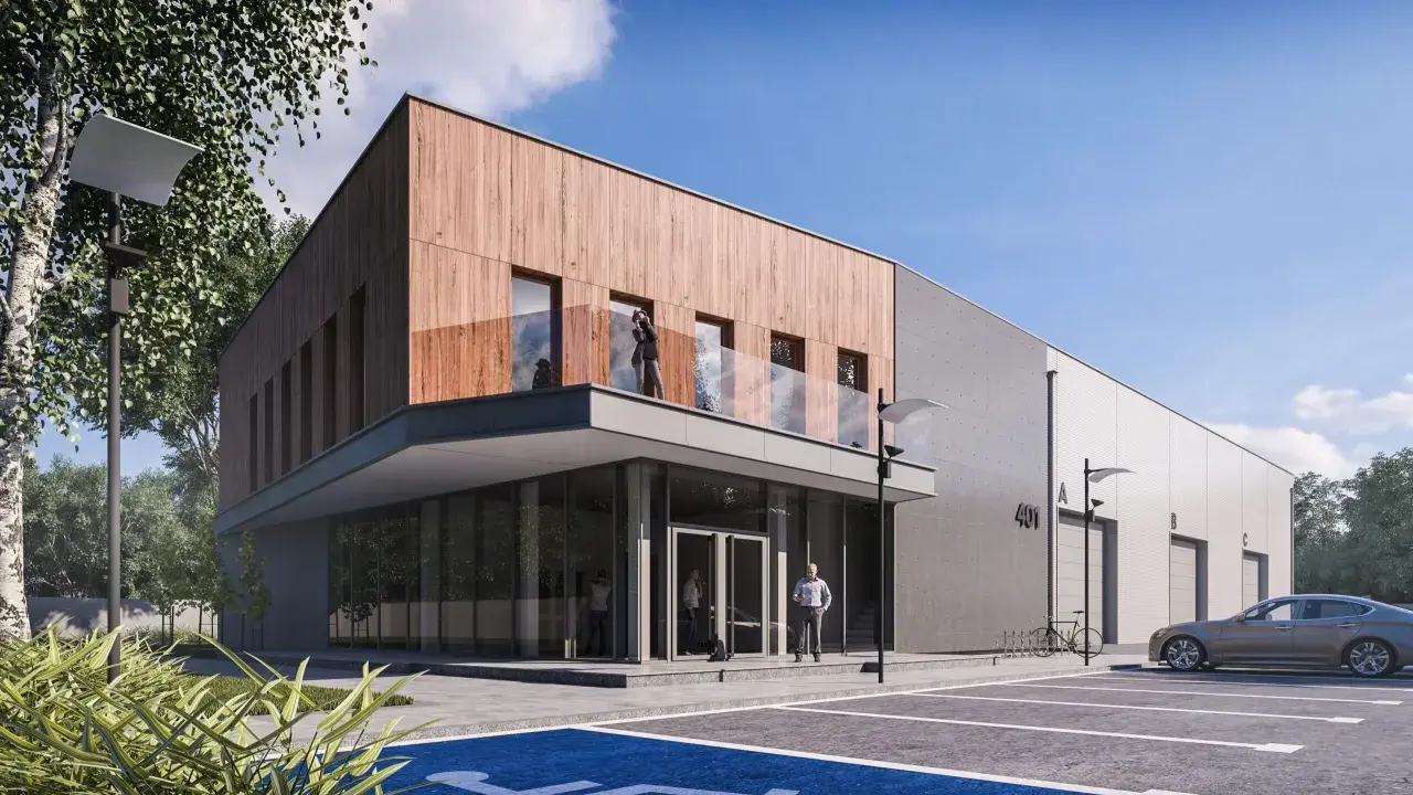Nowoczesny budynek biurowy projekt z drewnianą elewacją i betonem. Przed budynkiem parking z miejscem dla niepełnosprawnych.