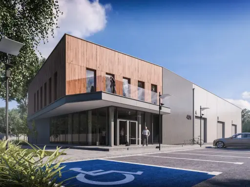 Nowoczesny budynek biurowy projekt z drewnianą elewacją i betonem. Przed budynkiem parking z miejscem dla niepełnosprawnych.