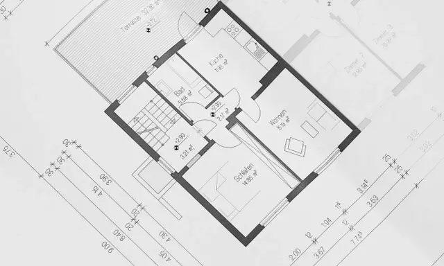 Projekt budynek gospodarczy 35m2: rzut parteru z kuchnią, łazienką, sypialnią, salonem i tarasem. Wymiary pomieszczeń i odległości.